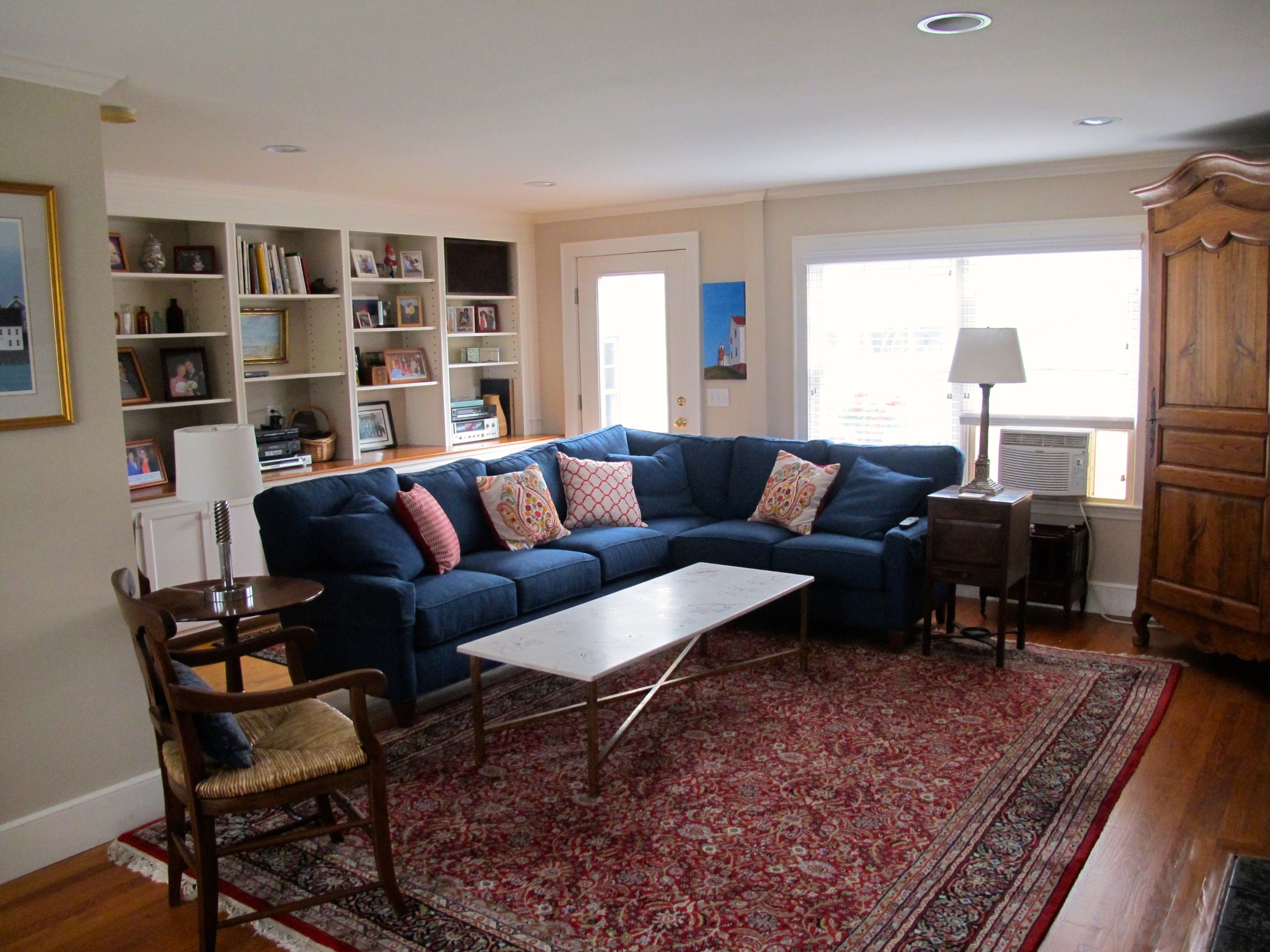 Blue couch on floor | Budget Flooring, Inc.